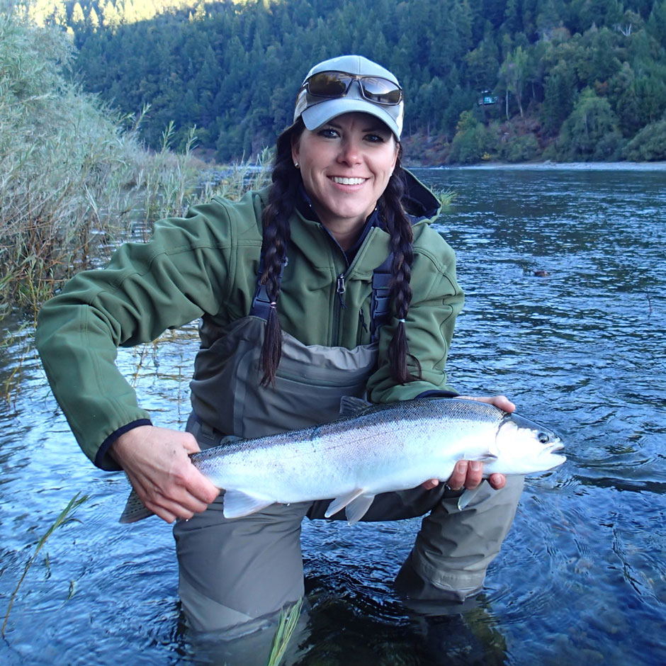 An angler with a chrome steelhead on the Lower Klamath River